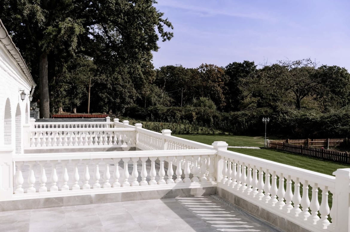 a white railing on a patio